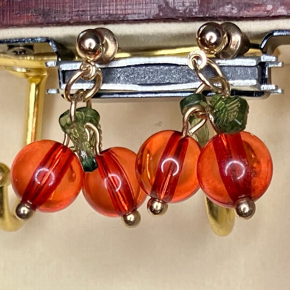 Gold studded earrings with cranberry charms